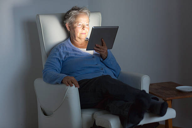 istock senior adult relaxing with digital tablet 543074804