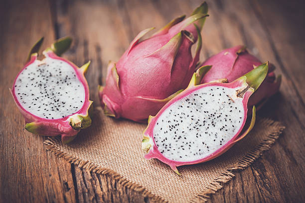 istock Dragon Fruit on the wooden background 543074884
