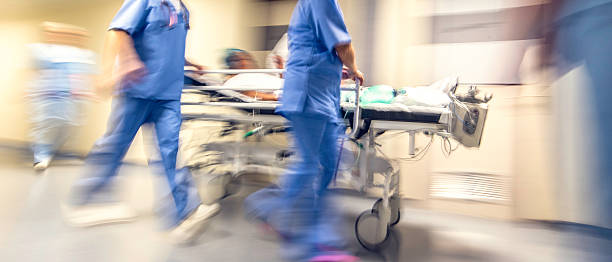 Blurred emergency in hospital Doctors and nurses pulling hospital trolley, emergency room photos stock pictures, royalty-free photos & images
