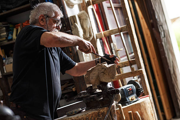 istock Senior sculptor working on his sculpture 543076754