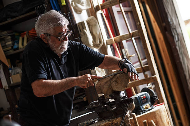istock Senior sculptor working on his sculpture 543076924