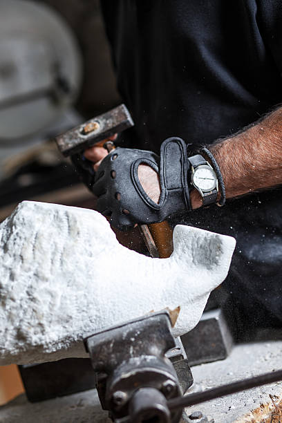 istock Senior sculptor working on his sculpture 543077738