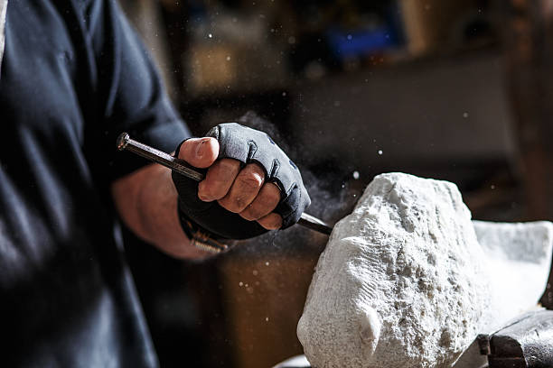 istock Senior sculptor working on his sculpture 543078174