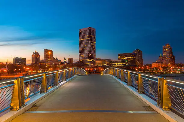 Downtown Milwaukee skyline at dusk from a footbridge in Lakeshore State Park (on the Hank Aaron State Trail.)  Perspective / Horizon effect used.
