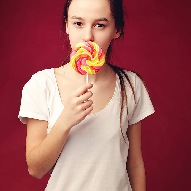 istock girl with big candy 543078668