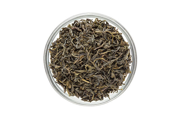 istock Organic Green Tea (Camellia sinensis) dried long leaves in bowl. 543080436