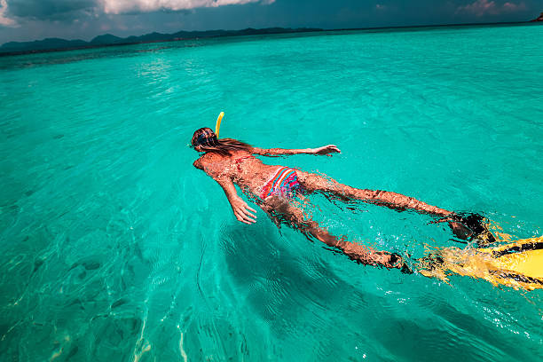 istock The young lady with snorkel and fins 543086088