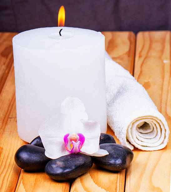 istock Candle, orchid, stones and towel 543086428