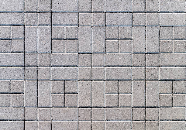 istock Street covered with gray concrete cubes 543086446