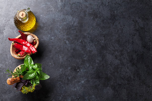 istock Garden herbs in mortar, oil and chili 543087766