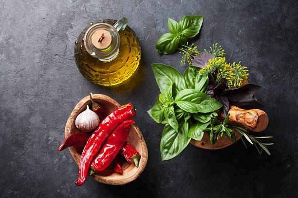 istock Garden herbs in mortar, oil and chili 543087876