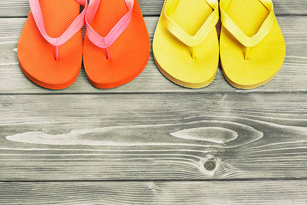 istock flip flop on old wooden texture 543088436