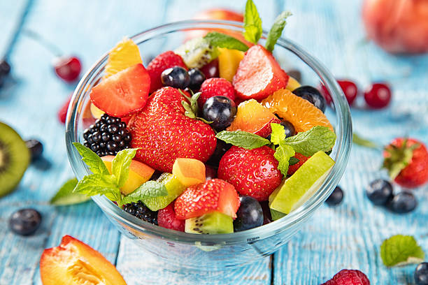 istock Fresh fruit salad served on wooden table 543173940
