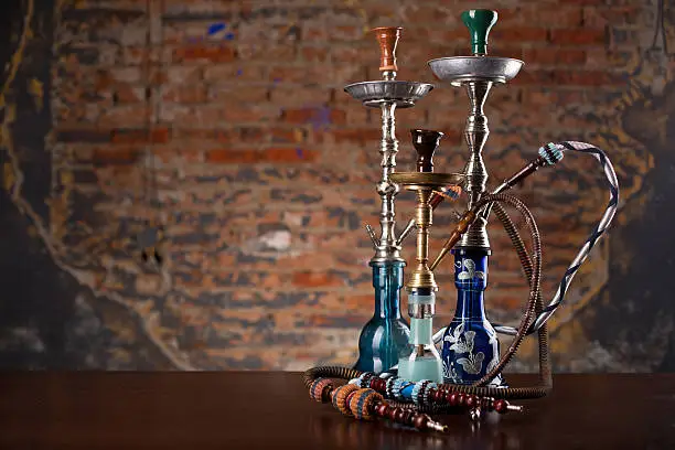 Photo of group of eastern hookahs on table