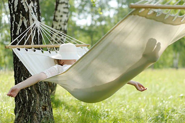 istock Woman resting in hammock. 543179524
