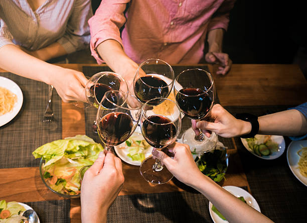 istock Friends celebrating over dinner and wine 543179702