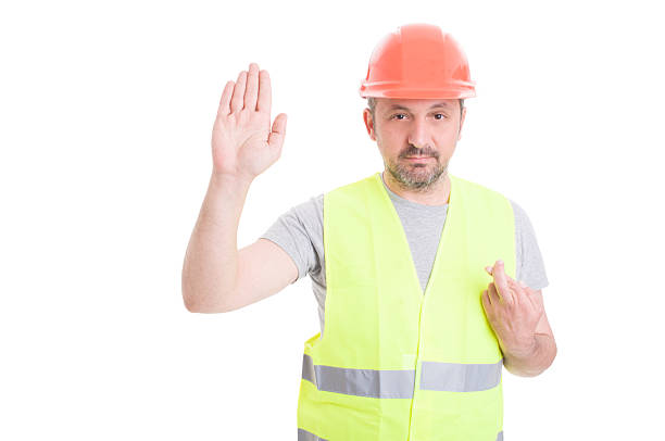 istock Serious builder rising his right hand and swearing false 543183606