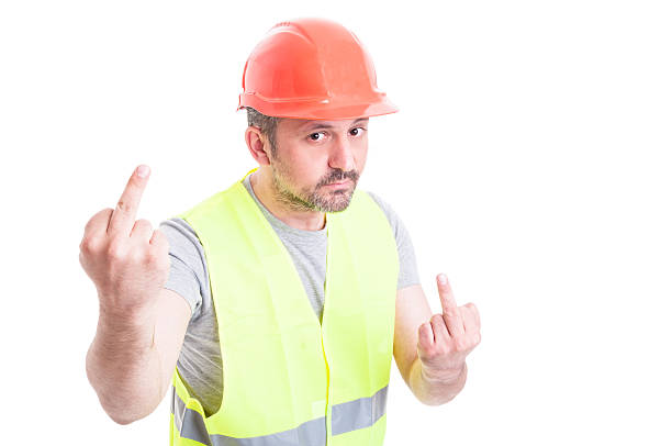 istock Insulting concept with handsome conctructor showing both middle 543184026