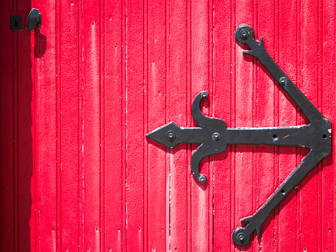 antique wooden red door of church