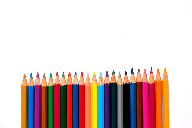 istock Row of color pencil placed on white background 543185872
