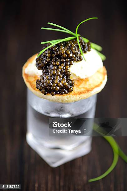 Blini And Real Black Caviar Appetizre With Vodka Stock Photo - Download Image Now - Caviar, Amuse Bouche, Blini