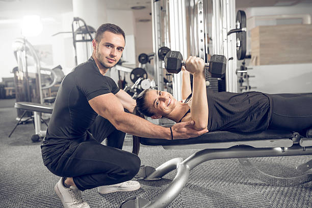 istock Woman doing fitness with personal trainer help. 543188562