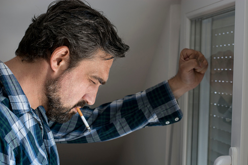 Frustrated man with cigarette