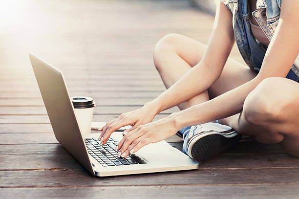 Young woman using a laptop outdoors