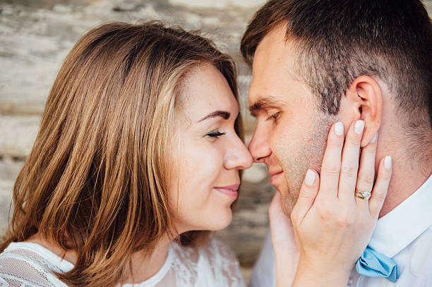 istock Happy Bride and groom walking on the green grass 543193492