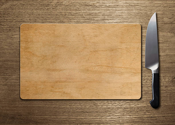 cutting board on wood table stock photo