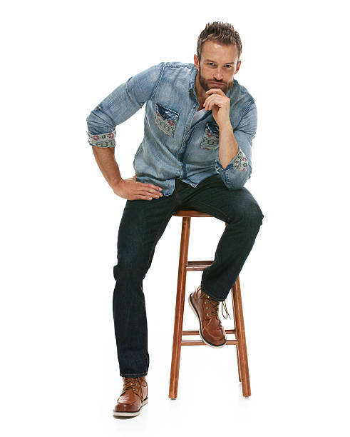 istock Casual man sitting and looking at camera 543194208