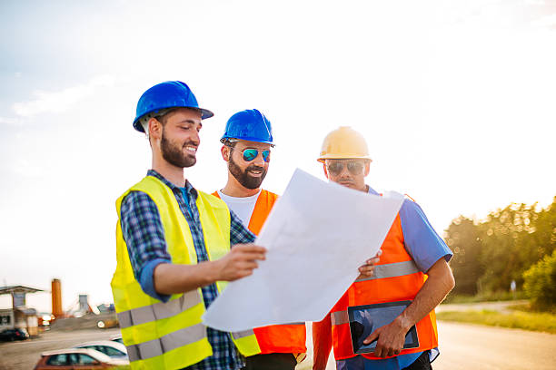 istock Portrait of successful engineers on construction site with blueprint 543194558