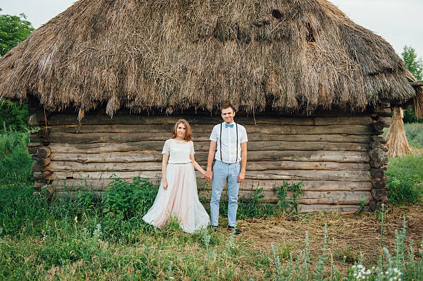 istock Happy Bride and groom walking on the green grass 543194668