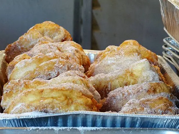 Malassada is a deep fried dough with sugar on top typical in Portuguese cuisine  