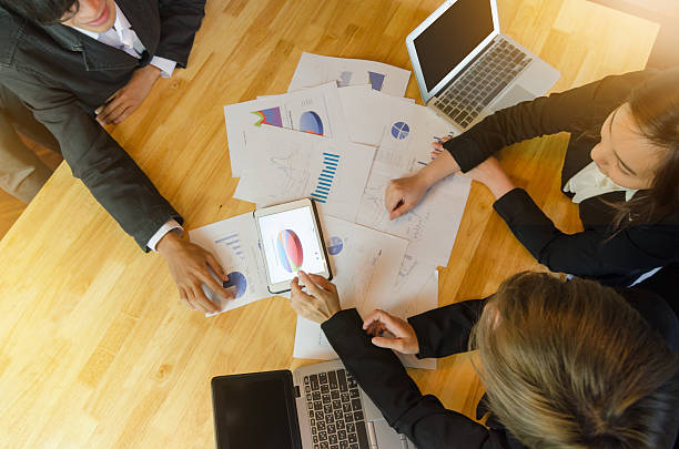 istock Top view of business people group view graph in tablet. 543196572