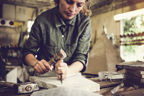Stonecutter woman portrait Stonecutter woman portrait at work, Ljubljana, Slovenia sculptor photos stock pictures, royalty-free photos & images