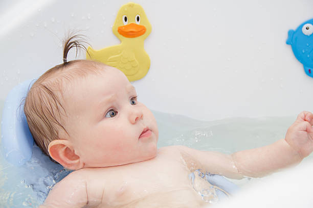 istock Newborn baby bathe and swim 543197382