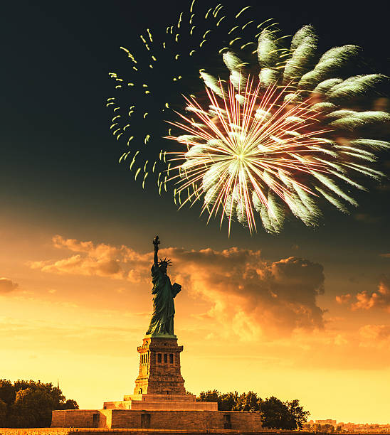 istock fireworks behind the statue of liberty 543198432