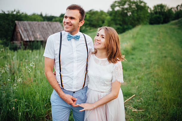 istock Happy Bride and groom walking on the green grass 543198640
