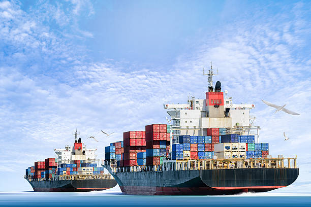 istock Cargo ship in the ocean with blue sky. 543198660