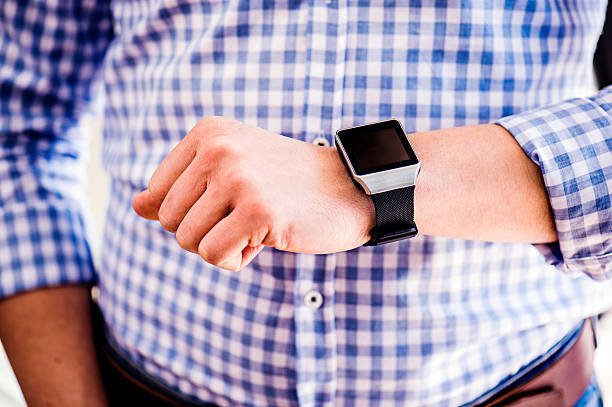 istock Close up of unrecognizable man using smart watch 543200252