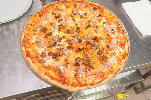 Traditional way baked wood fired oven Italian pizza bakery pizzeria.