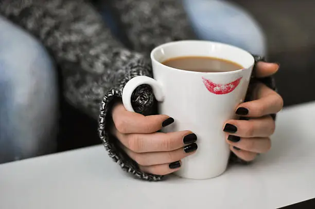 Photo of Cup of coffee with a lipstick mark