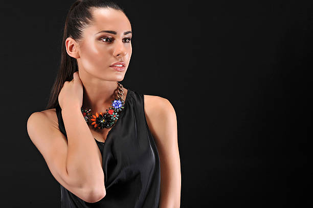 istock young beautiful model posing with black dress 543201312
