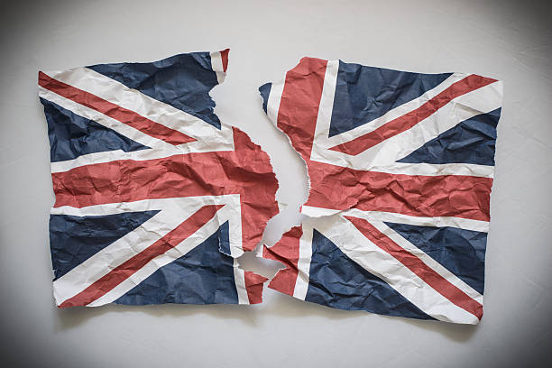 Brexit concept image: Union Jack ripped into two pieces.