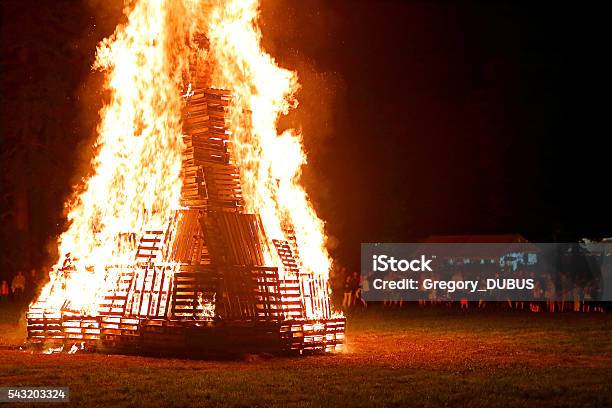 Crowd Of People Meeting Around Big Bonfire In Summer Stock Photo - Download Image Now