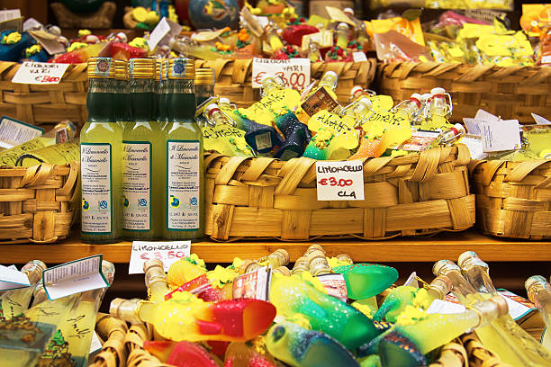 Lemoncello in Various Shapes Sold in Market in Amalfi Italy Amalfi, Italy - September 21, 2010: Lemoncello in Various Shapes Sold in Market in Amalfi Italy amalfi food stock pictures, royalty-free photos & images