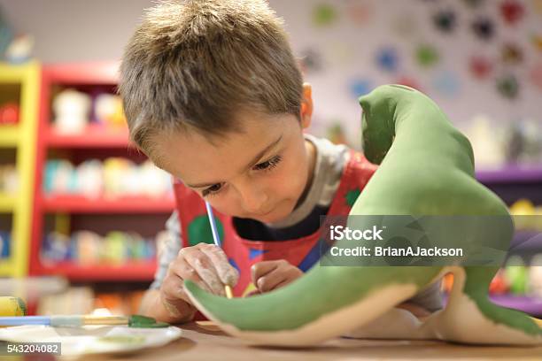 Creative Education Stock Photo - Download Image Now - Child, Dinosaur, Painting - Activity