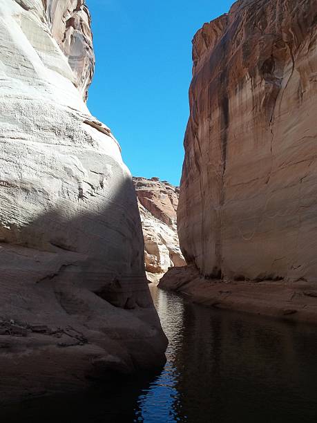istock water passage through rocks in lake 543204166