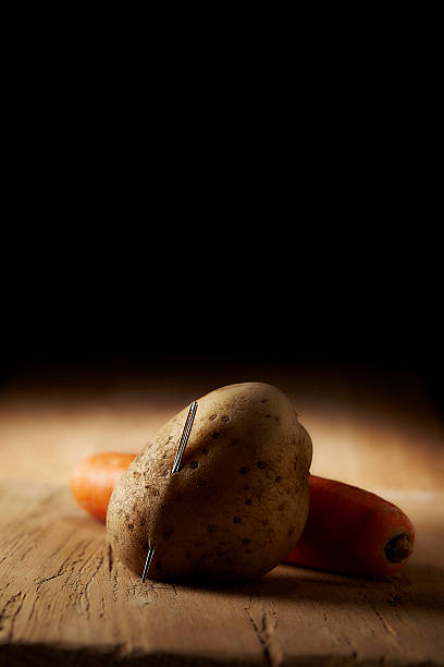 istock Food horror  - Sewing needle sticking in potato 543204466